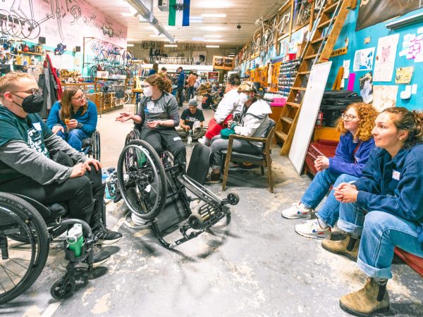 Community members talking amongst themselves at a workshop.